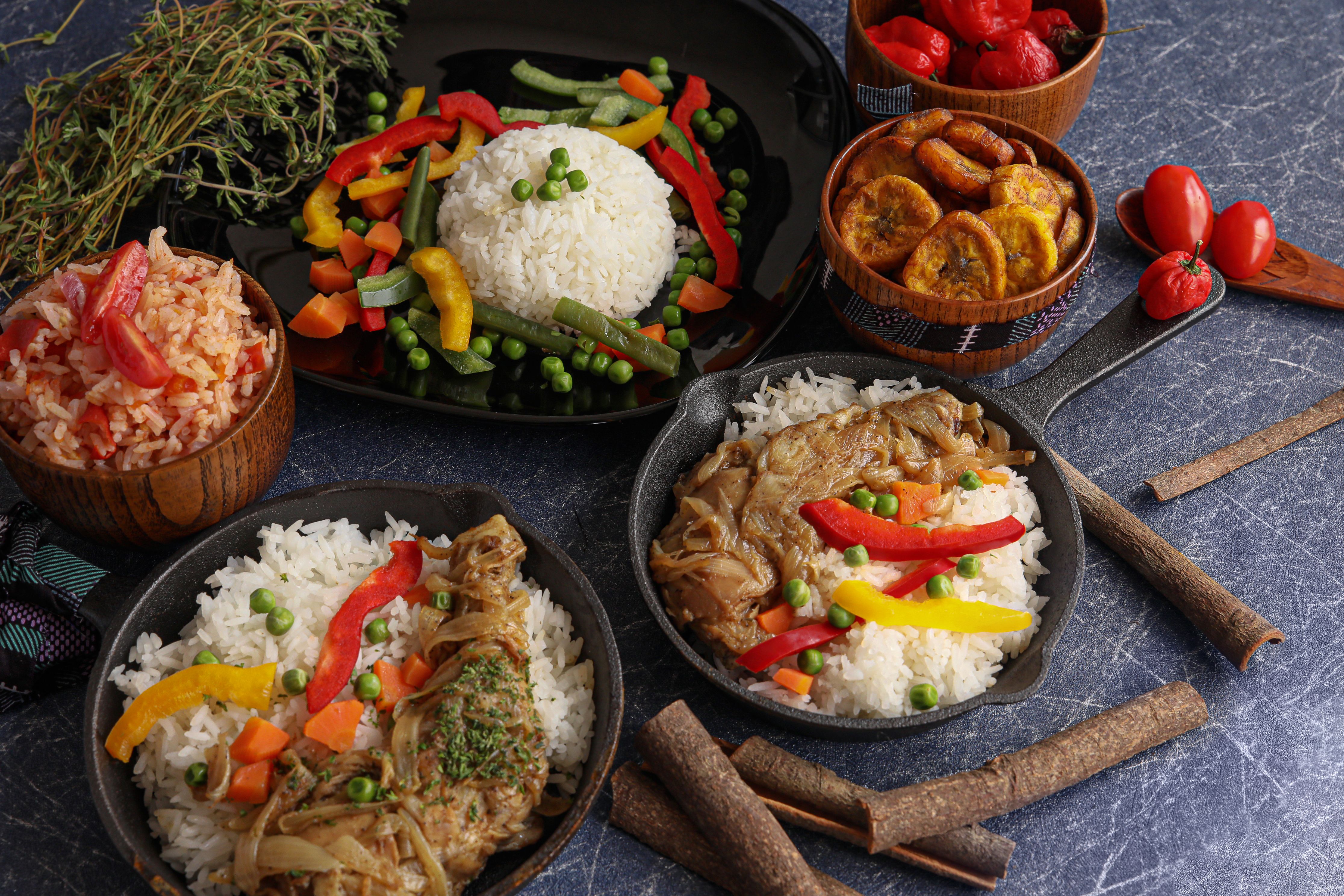 Rice, vegetables, chicken and fried plantain, a familiar Ghanaian food